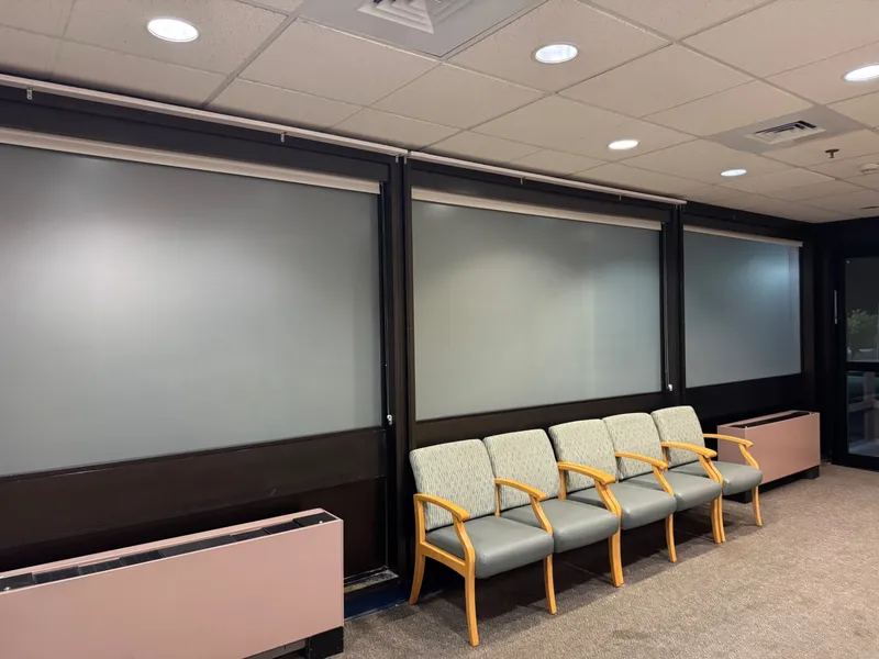 Same office waiting area after frosted privacy film was applied to the glass partitions.
